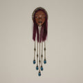 Handmade wall piece with original face sculpture and crystal beads hanging from chains